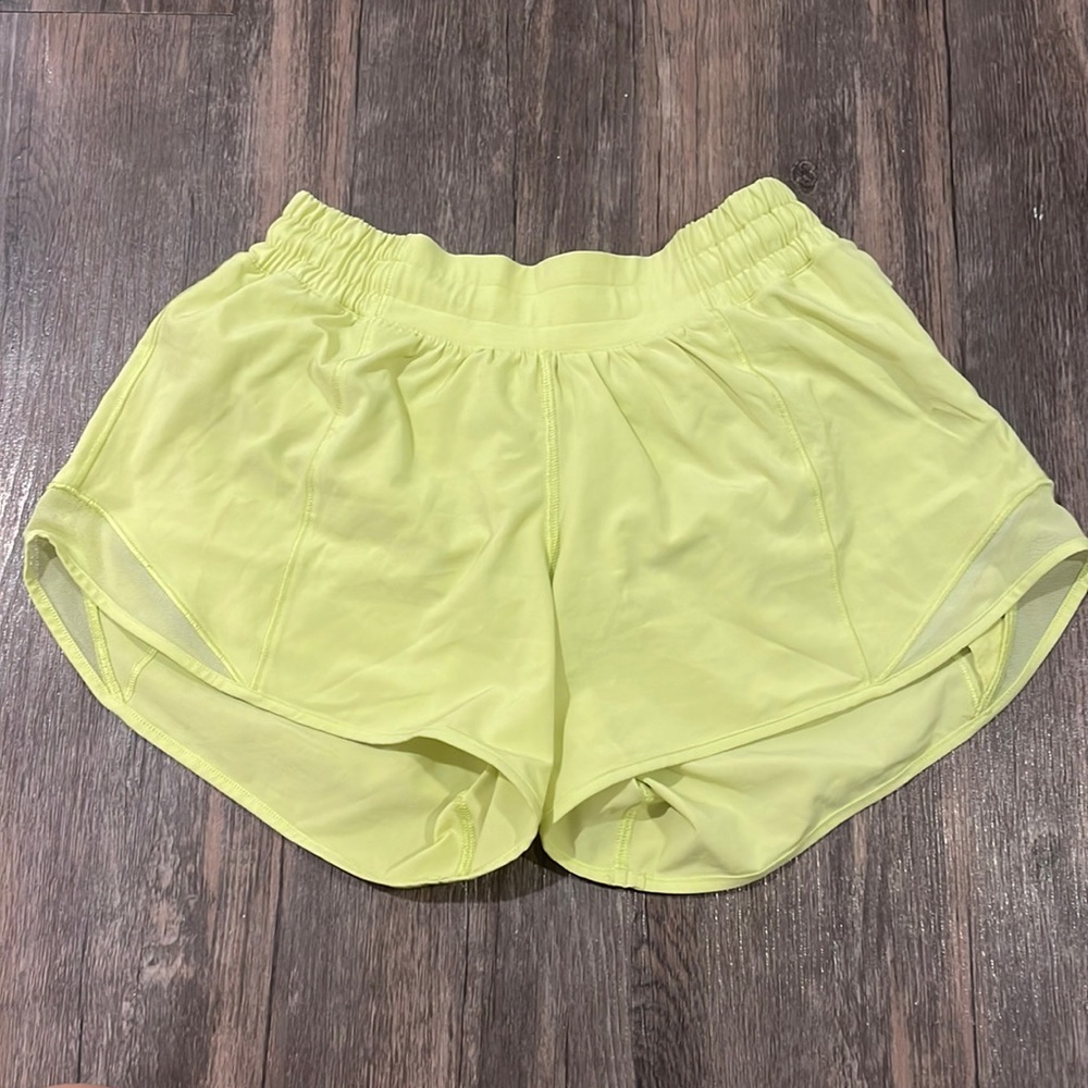 Size 4 Yellow Hotty Hot Lulu Lemon shorts 4 inch. Worn once. Perfect condition.